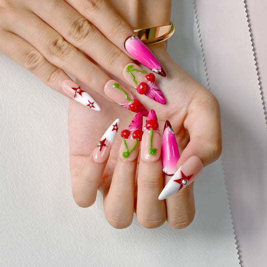 Cherry Pop Star press-on nails featuring pink ombre, 3D cherry accents, and red star details on a glossy nude base.