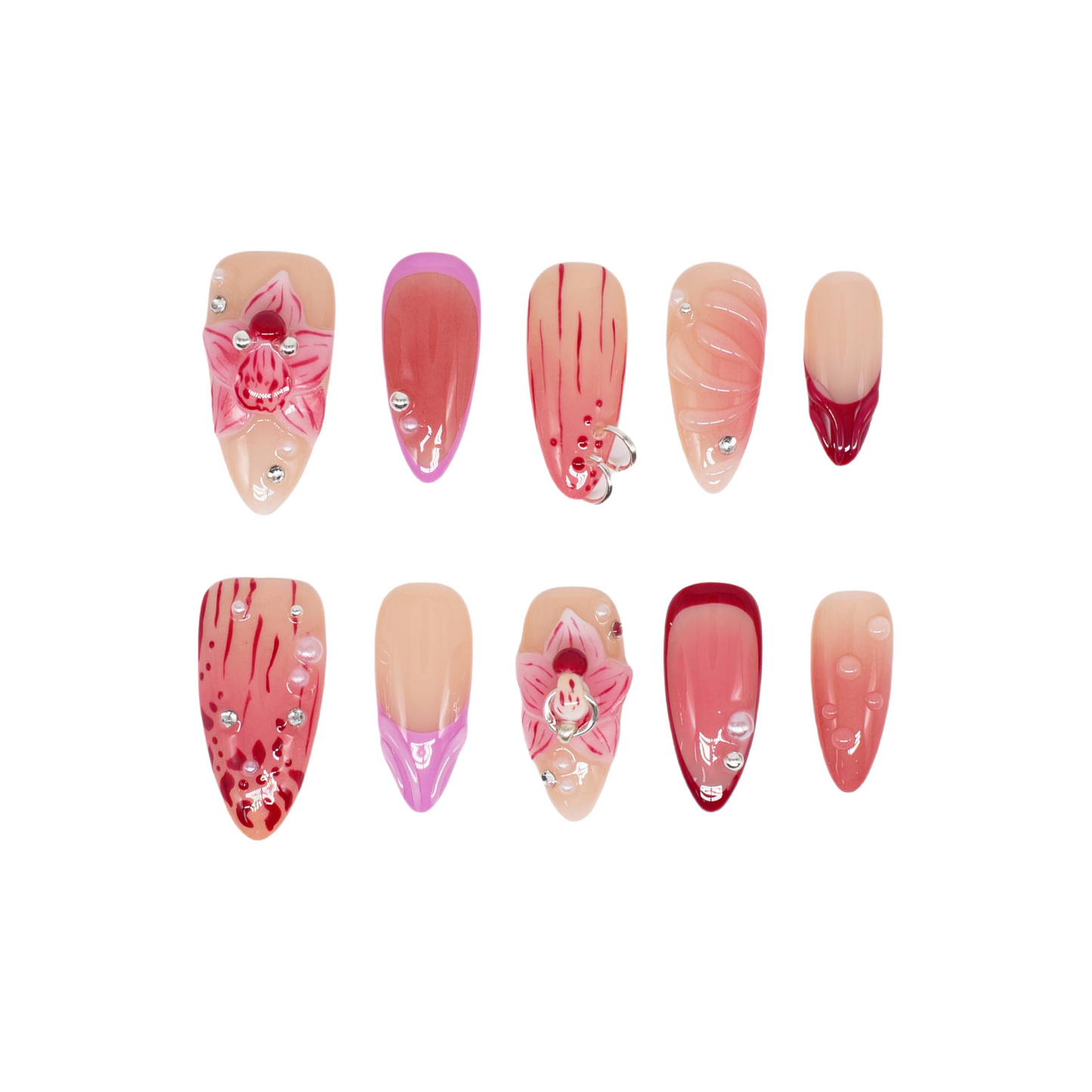 Medium Almond press-on nails in crimson and pink ombré with 3D orchid flowers, hand-painted streaks, and rhinestone accents.