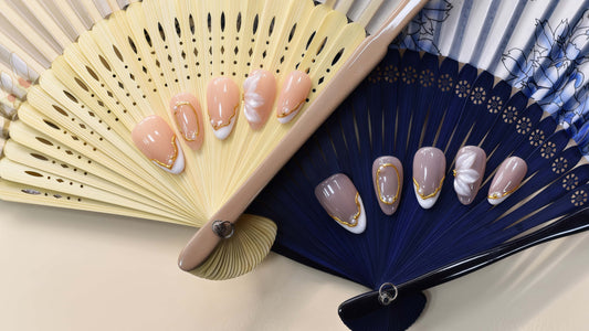 Porcelain Petal Frame blush press-on nails with milky sculpted petals, pearls and gold borders — styled product photograph.