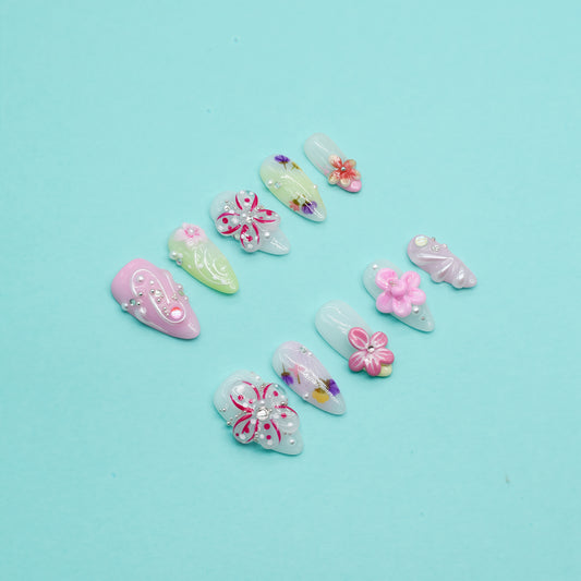 Floral Bliss long coffin press-on nails in pink and yellow gradient with 3D flowers, rhinestones, and floral art – Candy Bloom Collection