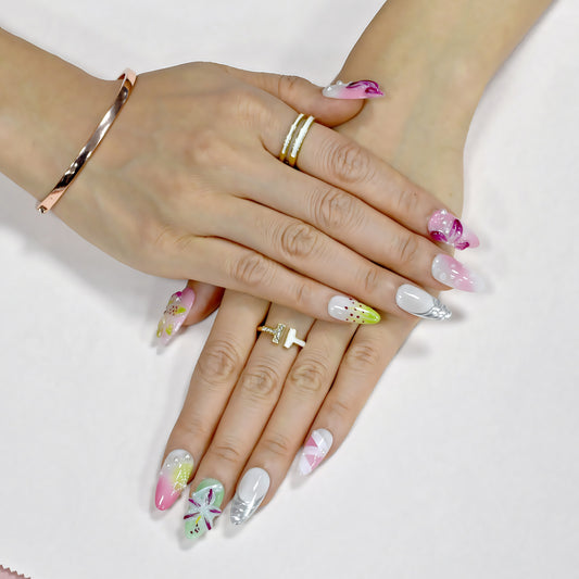 Floral Bliss long coffin press-on nails in pink and yellow gradient with 3D flowers, rhinestones, and floral art – Candy Bloom Collection