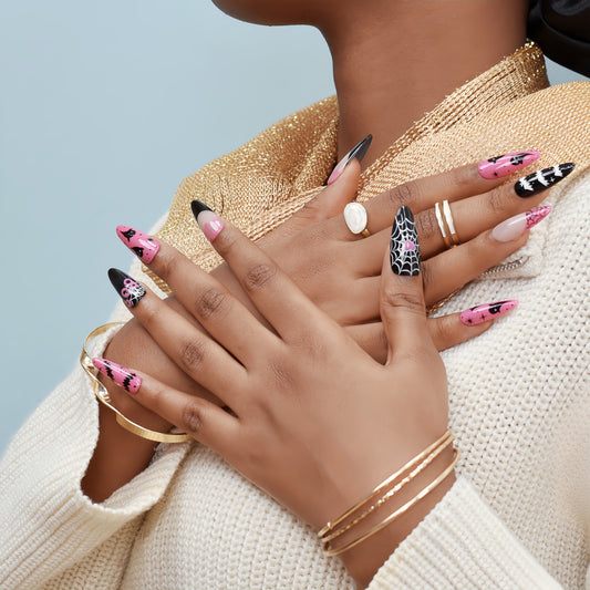 Halloween press-on nails with spider web, bats, ghosts, and dripping blood designs in black and pink.