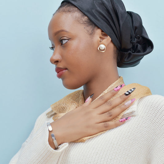 Halloween press-on nails with spider web, bats, ghosts, and dripping blood designs in black and pink.