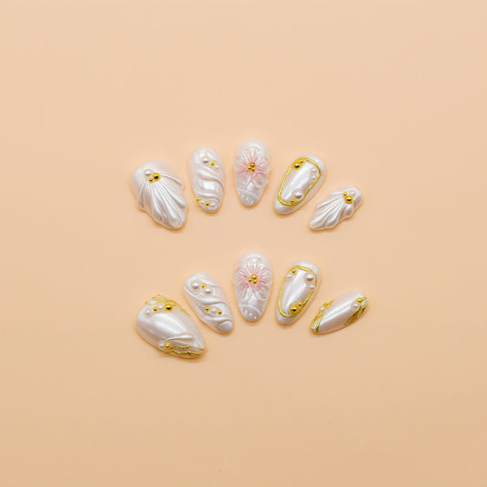 Almond-shaped coral and fuchsia press-on nails with tropical floral designs, 3D flowers, and ocean-inspired accents – Tropical Sunset Bloom set.