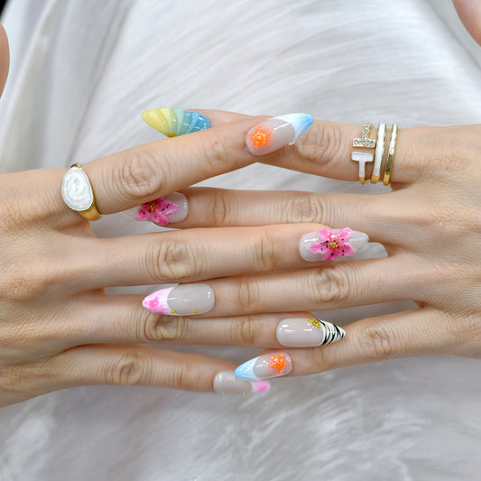 Medium almond tropical-themed press-on nails with zebra stripes, ombre seashell textures, 3D hibiscus flowers, and starfish accents.
