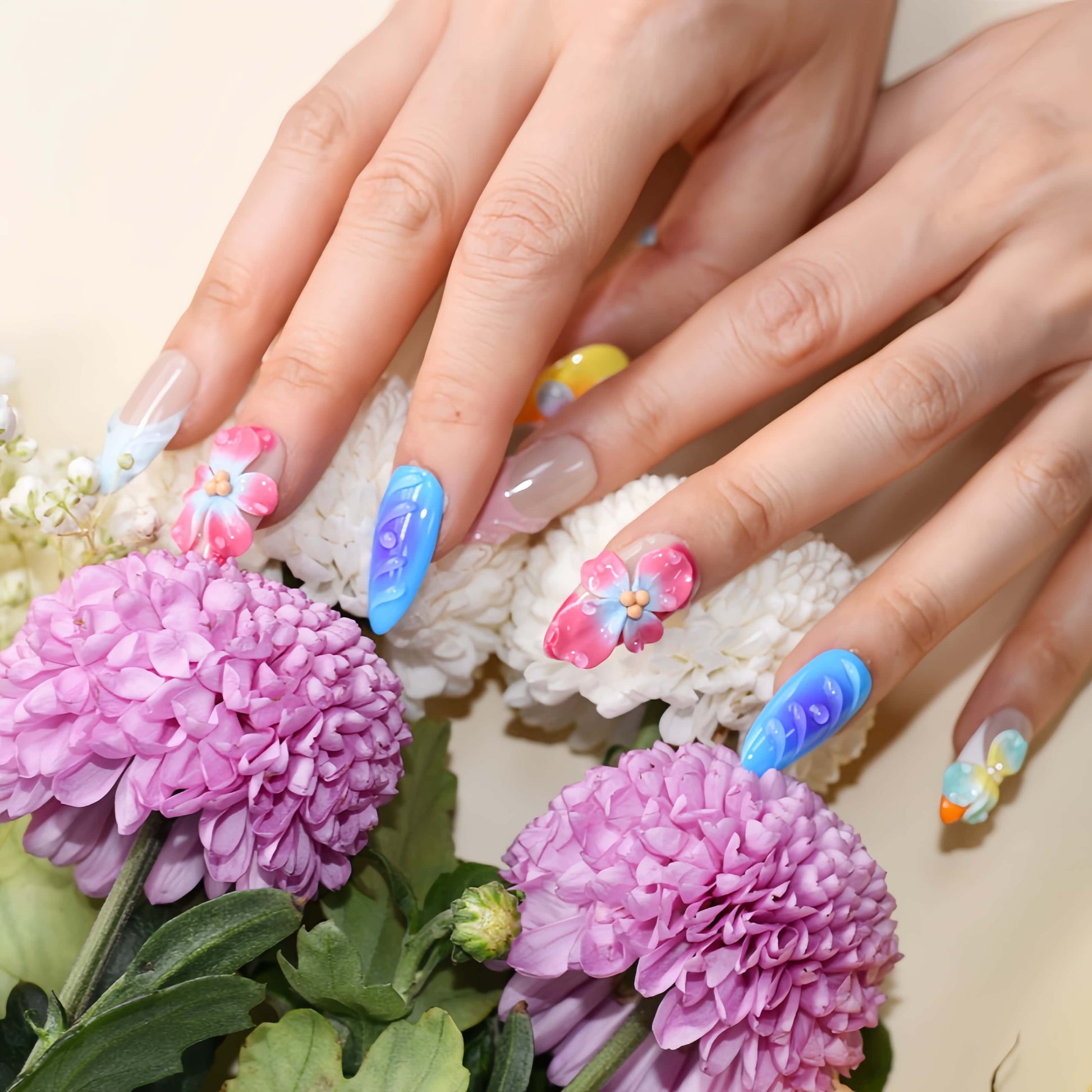 Handmade colorful tropical floral press-on nails with 3D hibiscus flowers, glossy sculpted details, and vibrant summer-inspired design