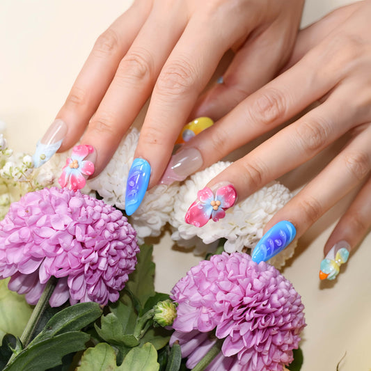 Handmade colorful tropical floral press-on nails with 3D hibiscus flowers, glossy sculpted details, and vibrant summer-inspired design