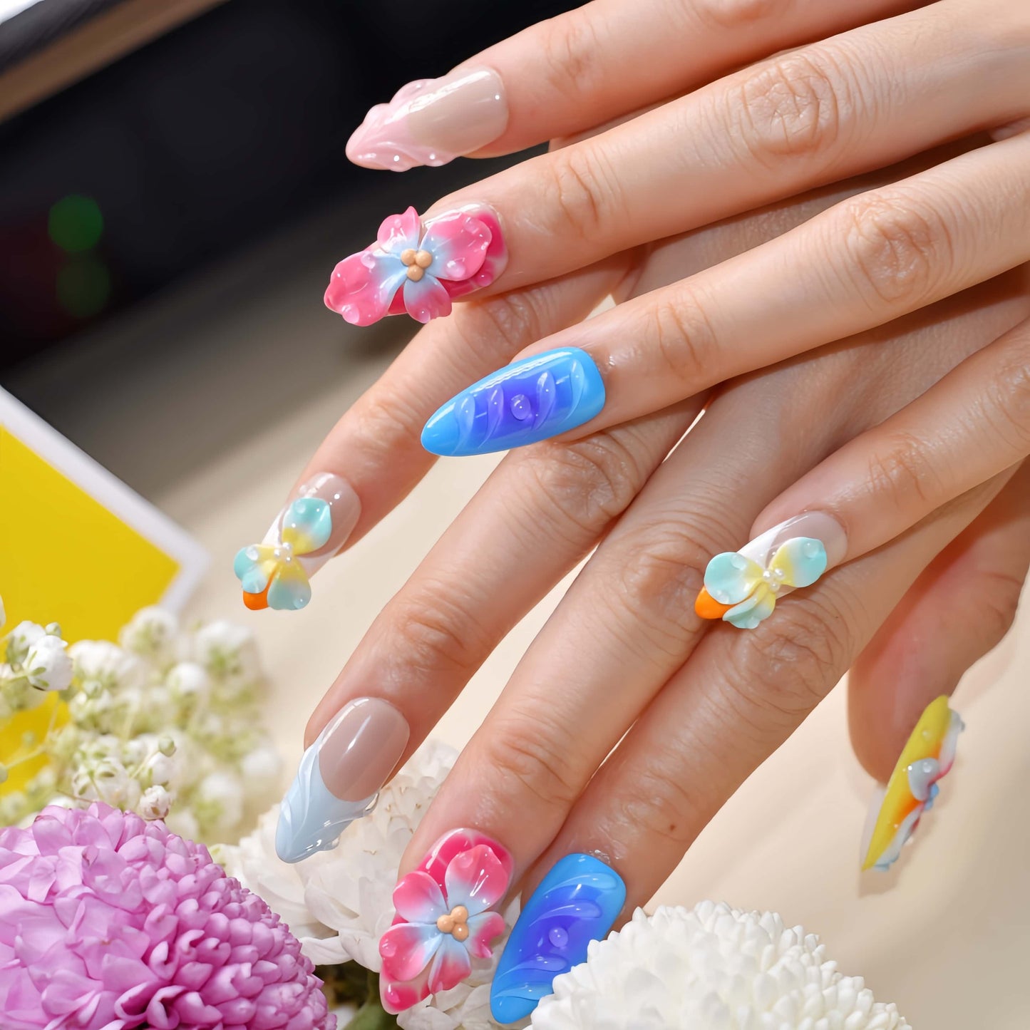 Handmade colorful tropical floral press-on nails with 3D hibiscus flowers, glossy sculpted details, and vibrant summer-inspired design