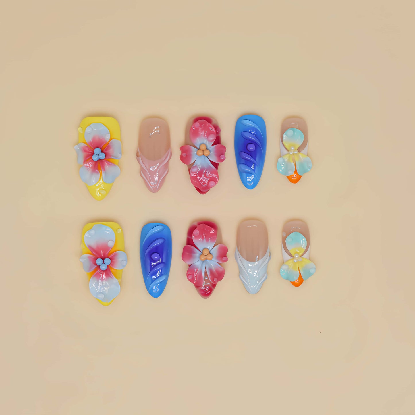 Handmade colorful tropical floral press-on nails with 3D hibiscus flowers, glossy sculpted details, and vibrant summer-inspired design