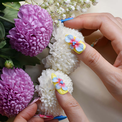 Handmade colorful tropical floral press-on nails with 3D hibiscus flowers, glossy sculpted details, and vibrant summer-inspired design