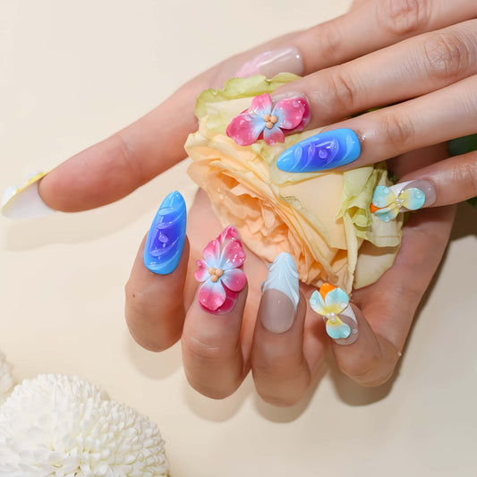 Handmade colorful tropical floral press-on nails with 3D hibiscus flowers, glossy sculpted details, and vibrant summer-inspired design
