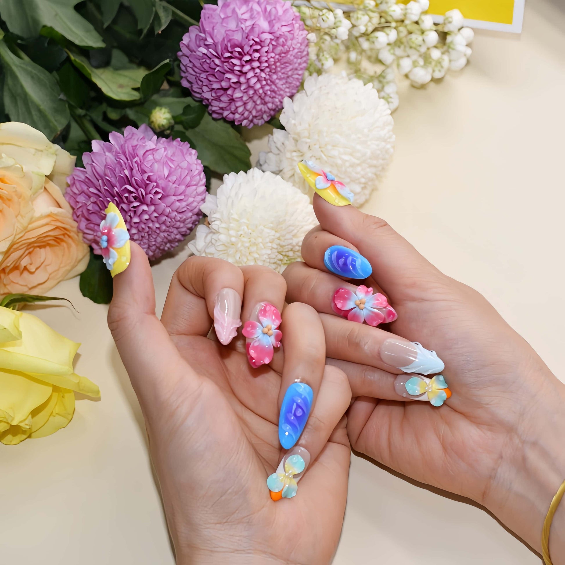 Handmade colorful tropical floral press-on nails with 3D hibiscus flowers, glossy sculpted details, and vibrant summer-inspired design