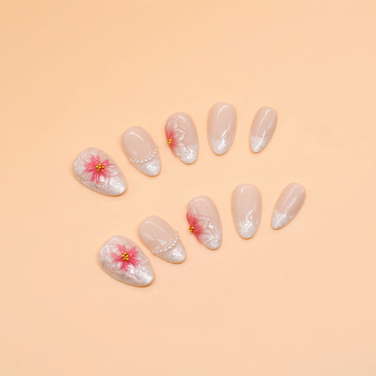 Nail art with floral designs on a beige background