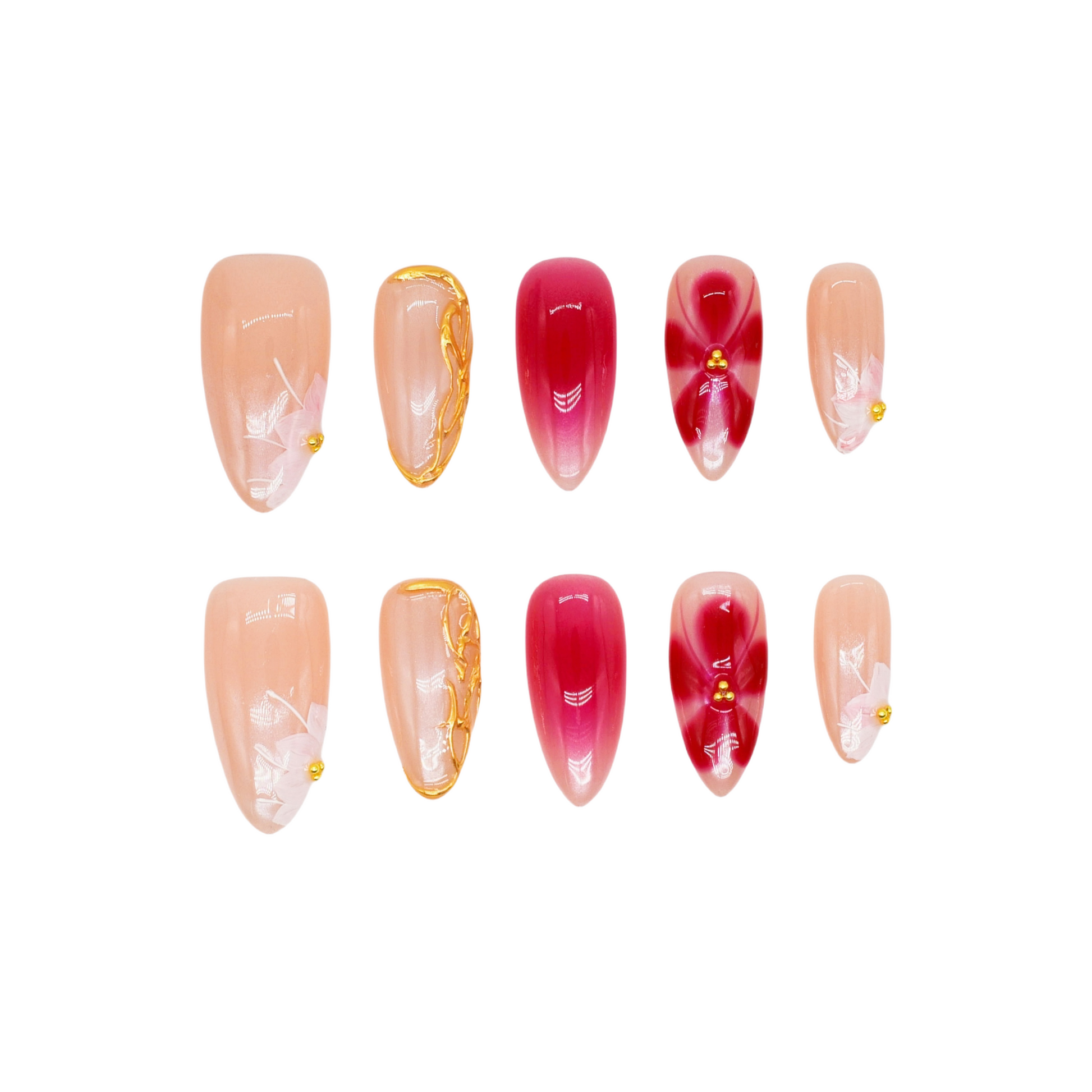 Medium almond press-on nails in nude and crimson ombré with white florals, gold beads, and sculpted gold frame.