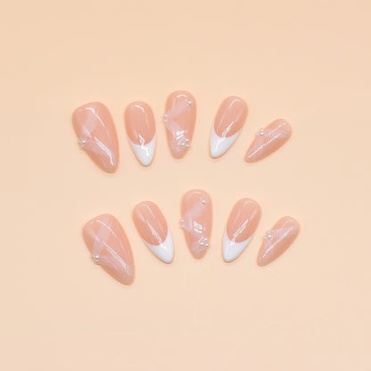 Crystal Dew almond press-on nails with soft pink base, clear tips, and 3D droplet accents.