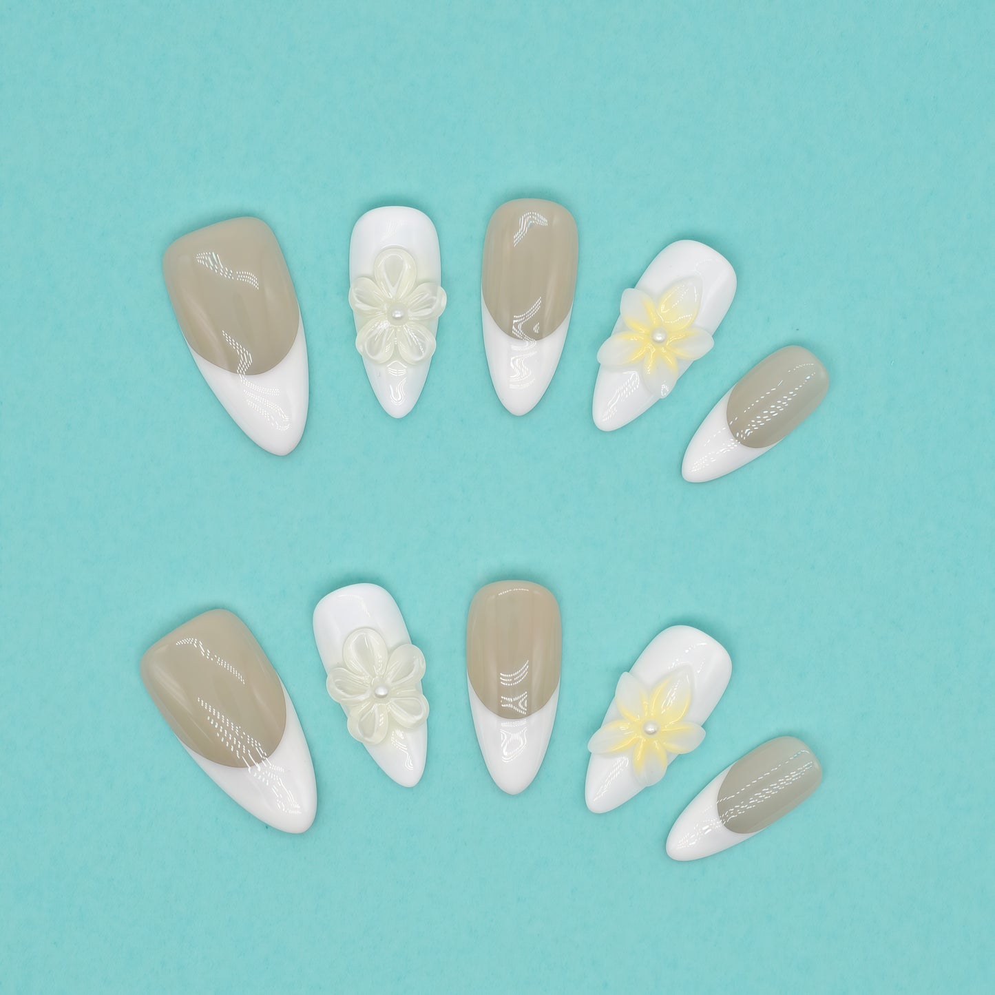 Elegant French tip press on nails with nude base, white tips, and 3D yellow floral accents – Heart & Beat Collection.