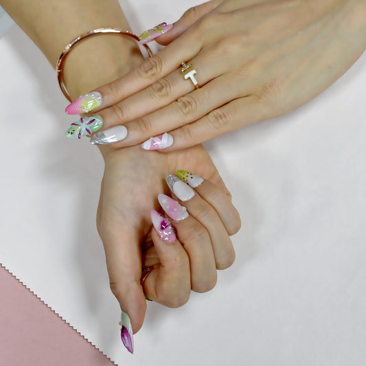 Floral Bliss long coffin press-on nails in pink and yellow gradient with 3D flowers, rhinestones, and floral art – Candy Bloom Collection