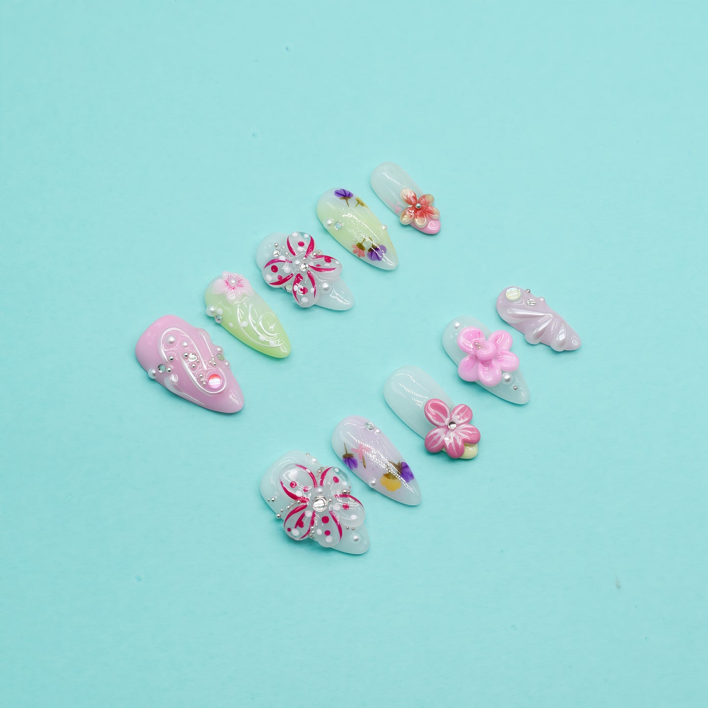 Floral Bliss long coffin press-on nails in pink and yellow gradient with 3D flowers, rhinestones, and floral art – Candy Bloom Collection