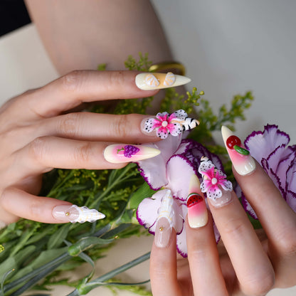 Handmade tropical fruit-inspired press-on nails with 3D floral art, ombré gradients, glossy finish, and transparent ribbon details