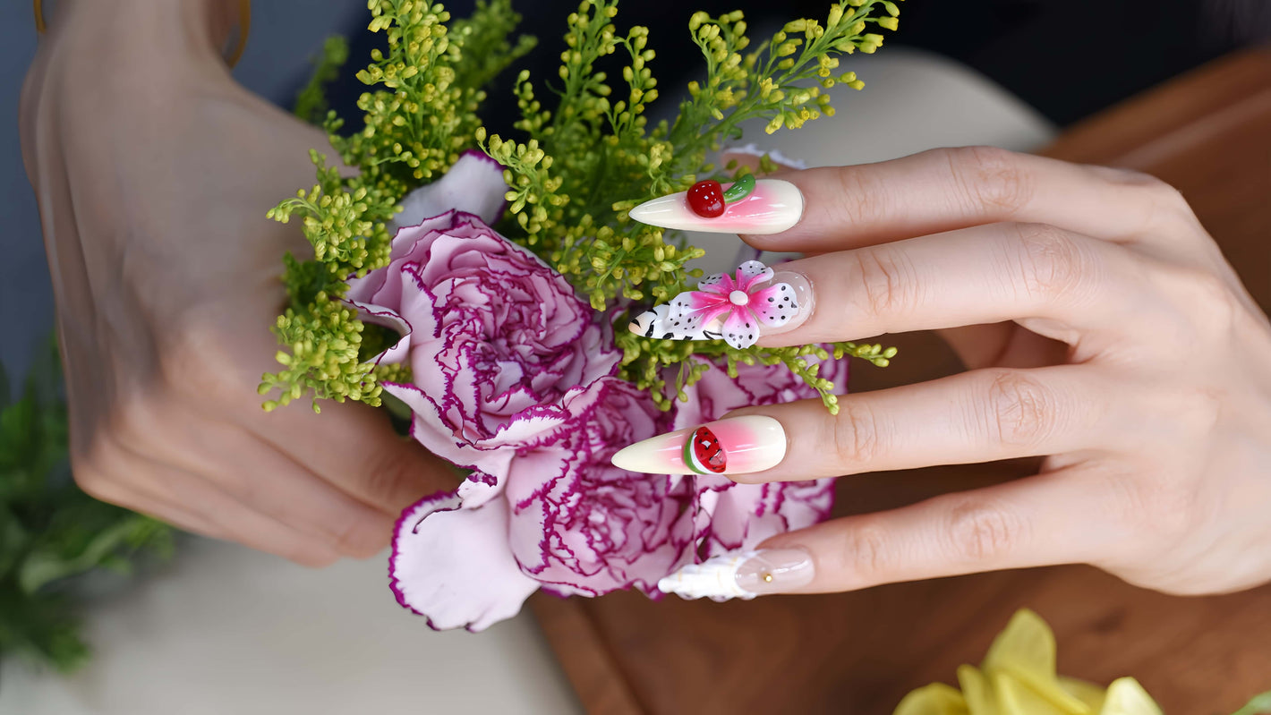 Handmade tropical fruit-inspired press-on nails with 3D floral art, ombré gradients, glossy finish, and transparent ribbon details