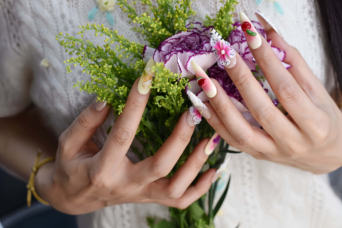 Handmade tropical fruit-inspired press-on nails with 3D floral art, ombré gradients, glossy finish, and transparent ribbon details