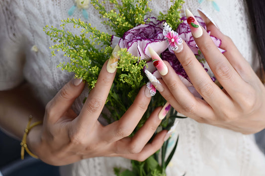 Handmade tropical fruit-inspired press-on nails with 3D floral art, ombré gradients, glossy finish, and transparent ribbon details