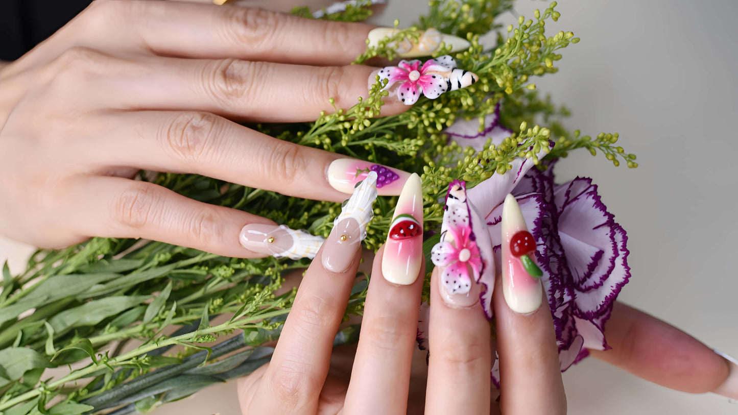 Handmade tropical fruit-inspired press-on nails with 3D floral art, ombré gradients, glossy finish, and transparent ribbon details