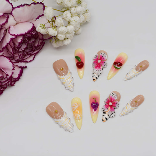 Handmade tropical fruit-inspired press-on nails with 3D floral art, ombré gradients, glossy finish, and transparent ribbon details