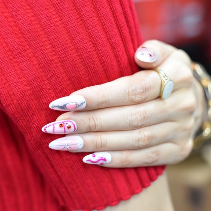 Medium almond press-on nails in pink gradient with chrome stars, neon smileys, and 3D hearts – Galactic Girl from You Are Angel.