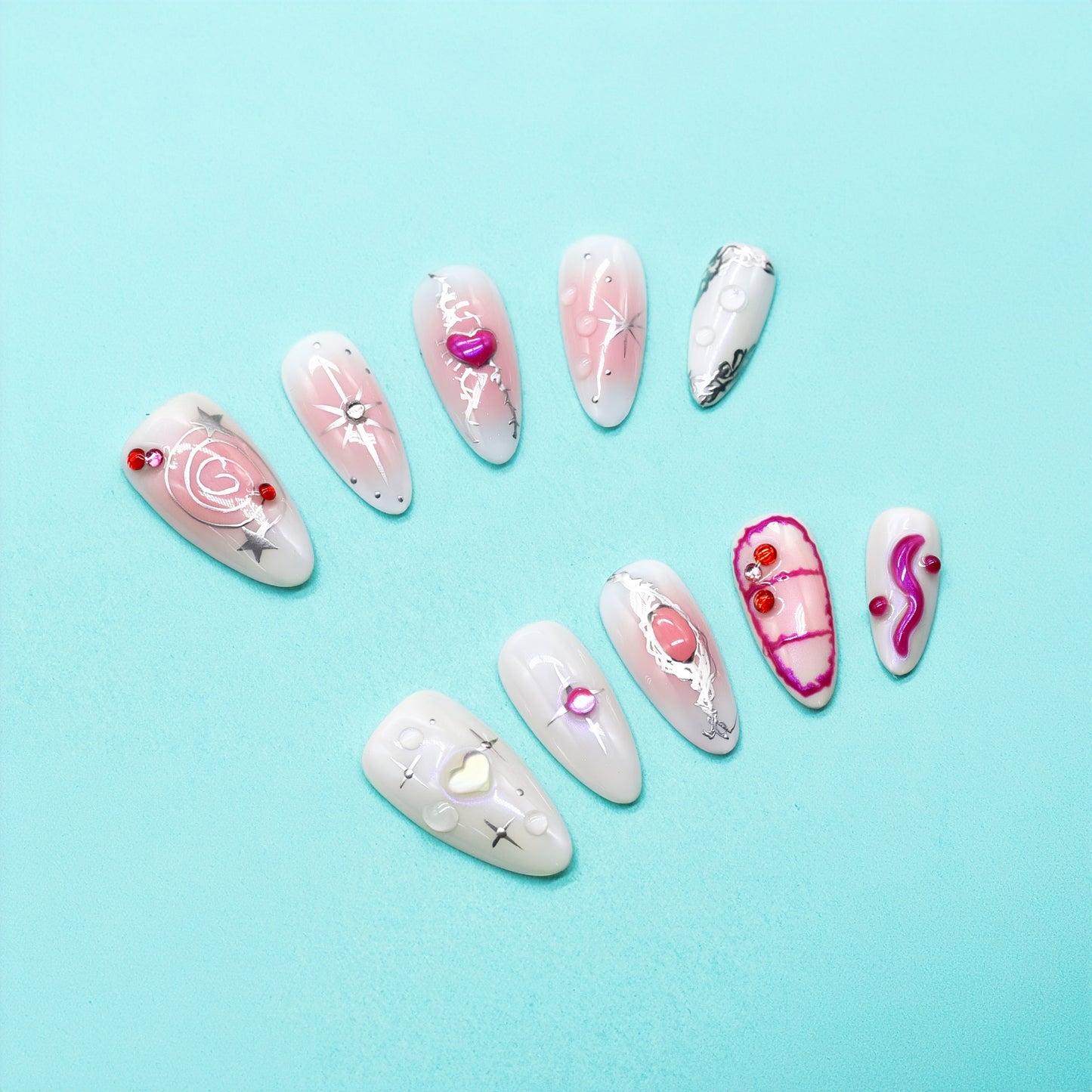 Almond press-on nails in pink gradient with chrome stars, neon smileys, and 3D hearts – Galactic Girl from You Are Angel.