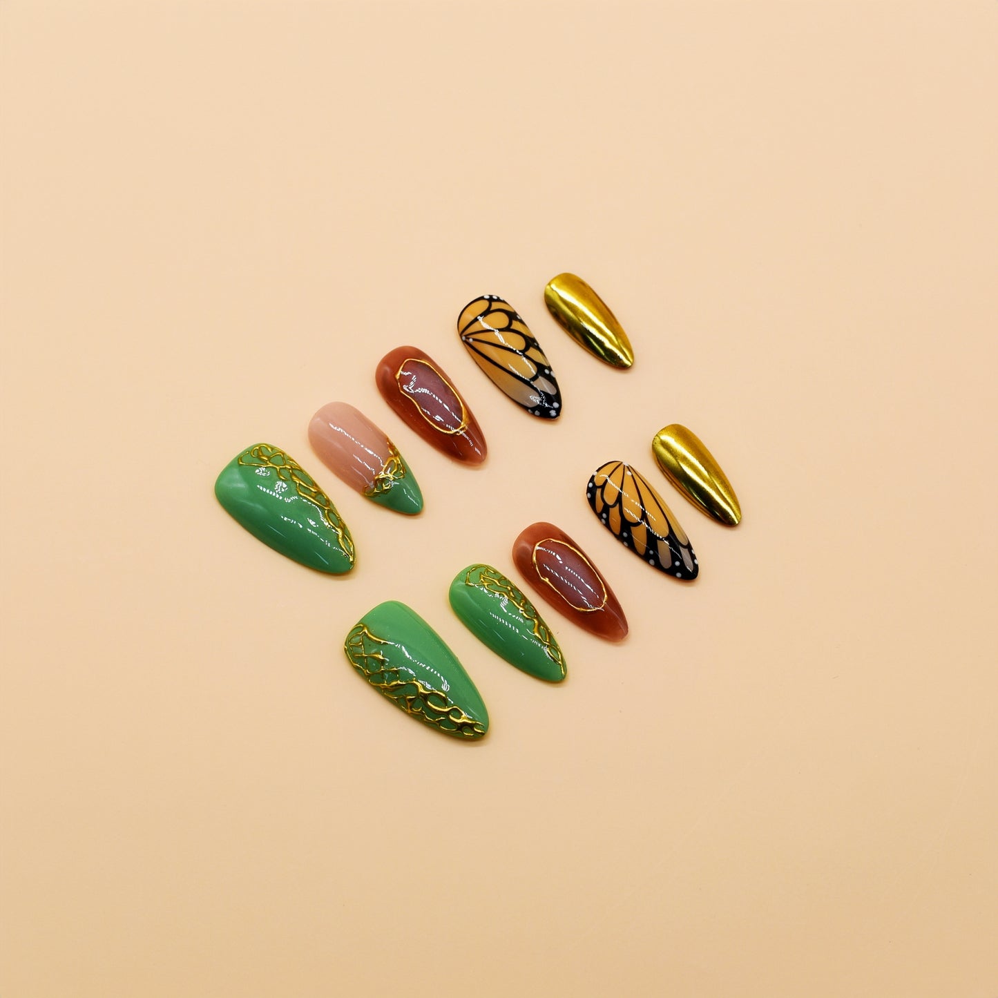 Golden Monarch handmade press-on nails by You Are Angel with butterfly wing designs, green vines, and gold chrome accent nails.