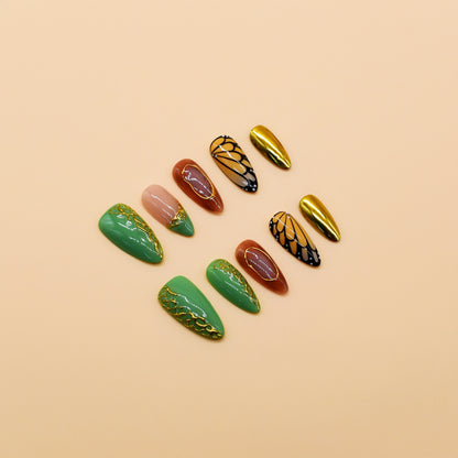 Golden Monarch handmade press-on nails by You Are Angel with butterfly wing designs, green vines, and gold chrome accent nails.