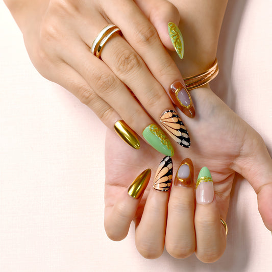 Golden Monarch handmade press-on nails by You Are Angel with butterfly wing designs, green vines, and gold chrome accent nails.