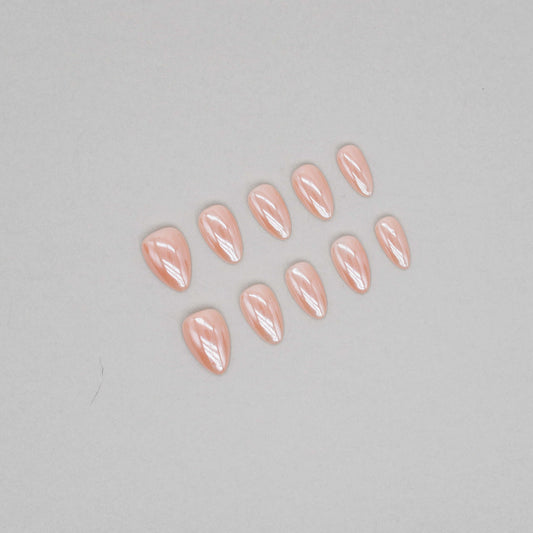 “Golden glow shimmer press-on nail base set with glossy pearl finish.”