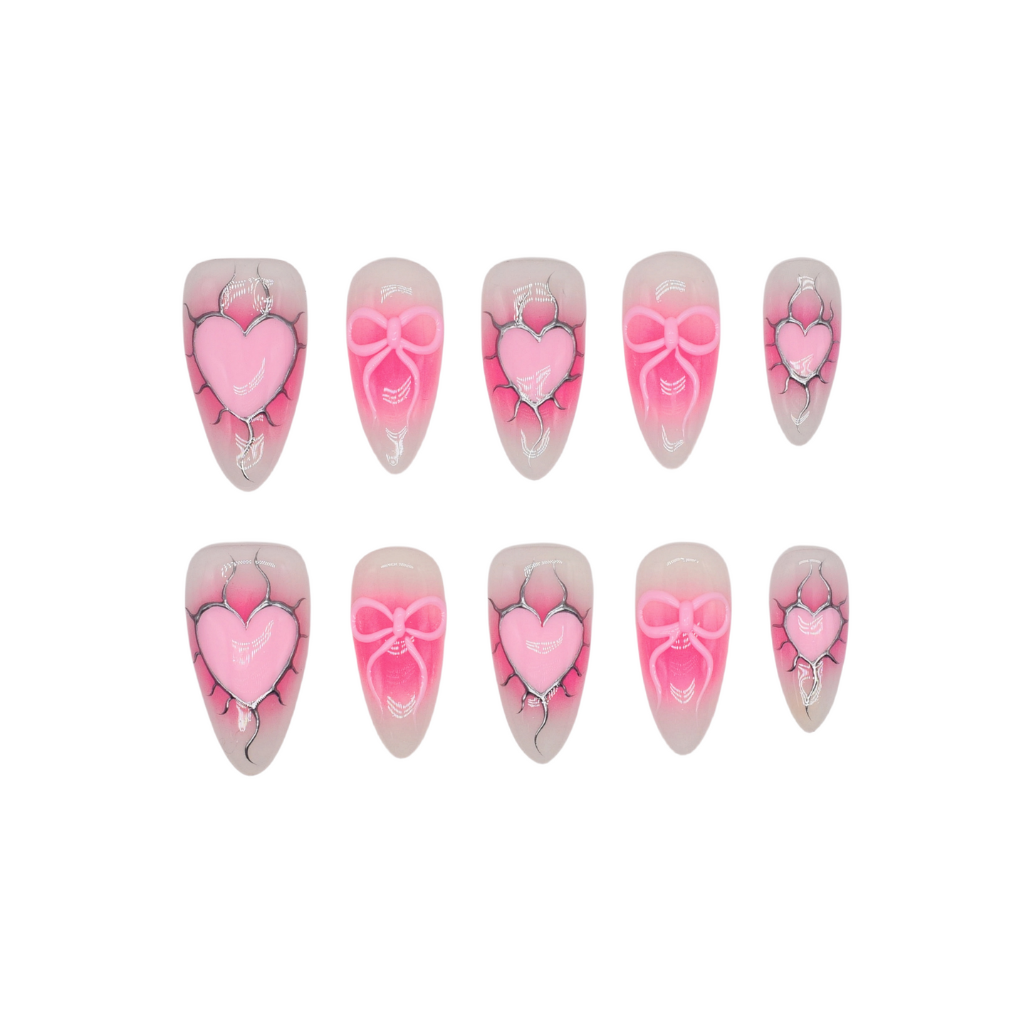 Medium almond press-on nails with nude-to-pink ombré, 3D pink hearts, bows, and crack detailing.
