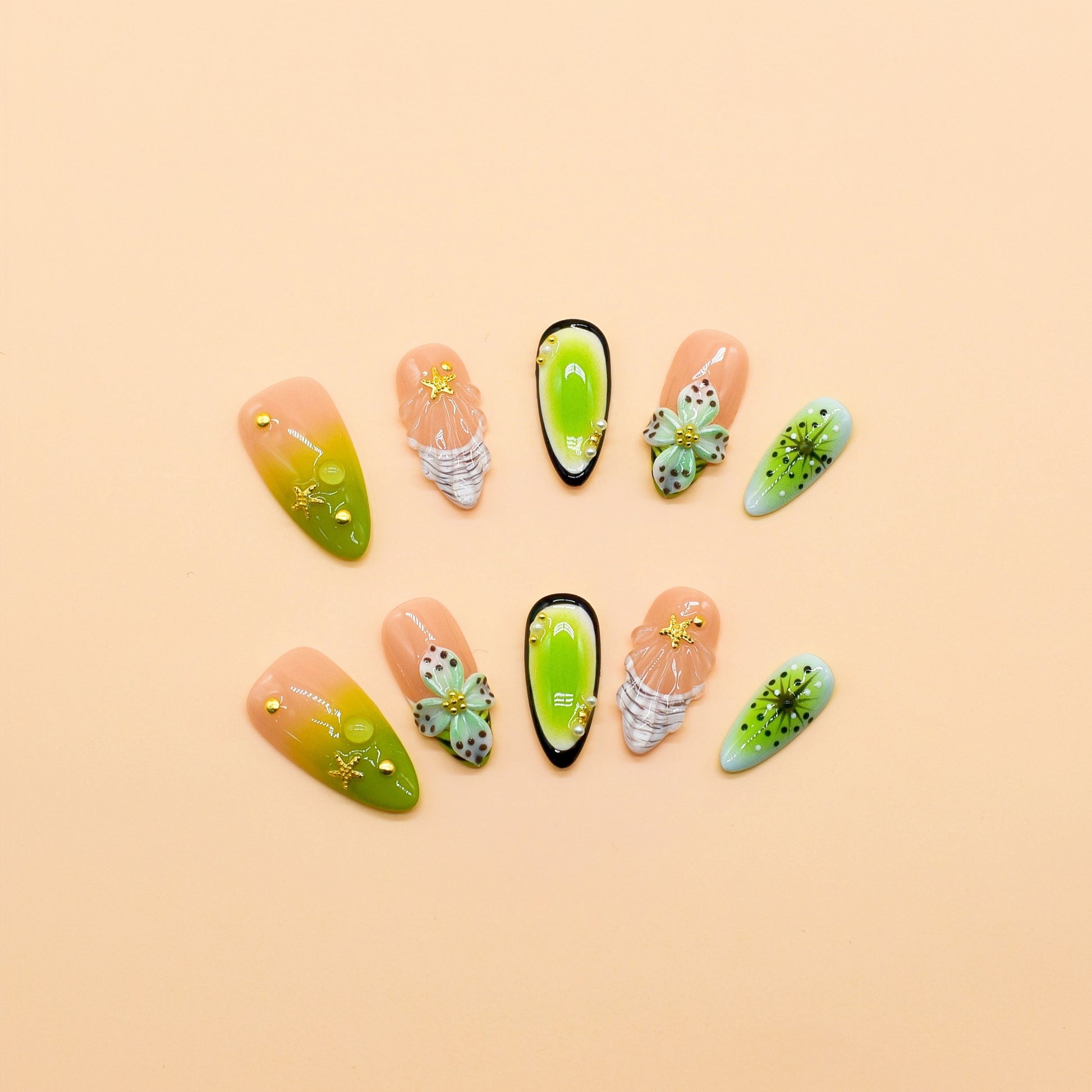 Tropical green almond press-on nail set with 3D floral and starfish designs, featuring kiwi gradient colors and shell carvings.