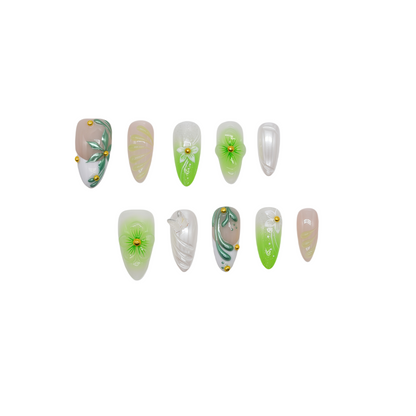 Green and white floral press-on nails with 3D blossoms, leaf detailing, and gold embellishments – handmade by You Are Angel.