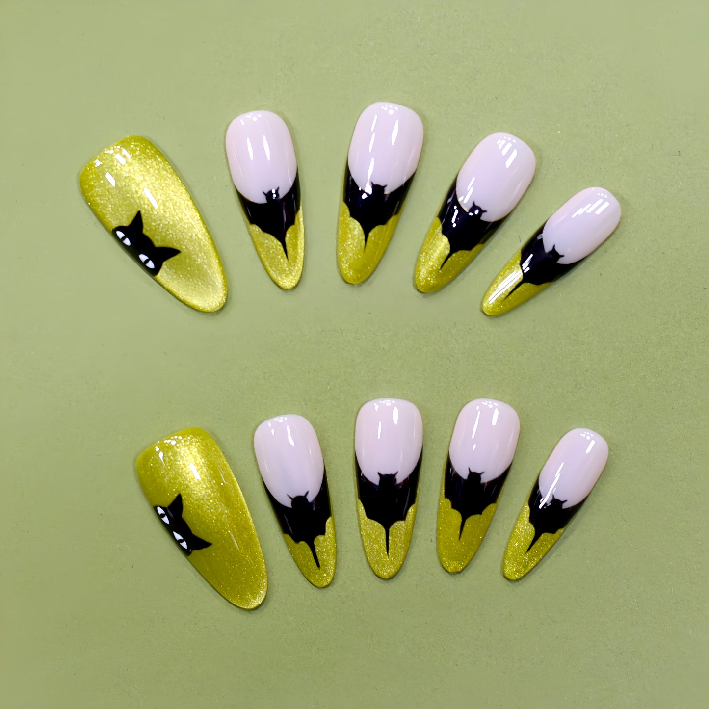 Neon green Halloween press-on nails with black bat silhouettes.