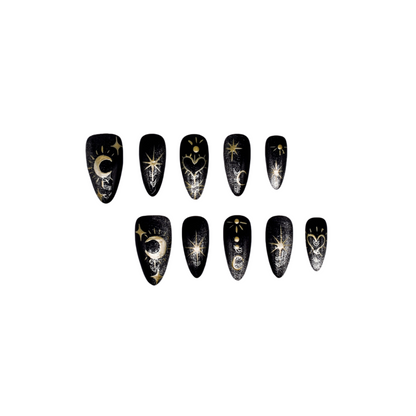 Moonlight Ritual handmade press-on nails by You Are Angel featuring black base with gold celestial art including moons, stars, and hearts.
