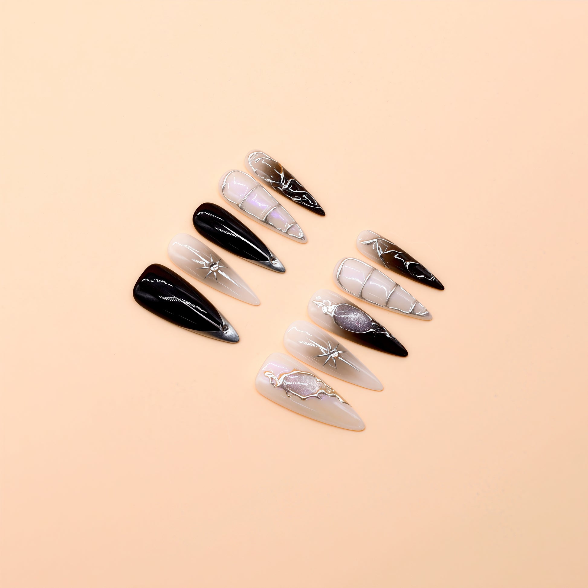 Handcrafted long almond press-on nails with black-to-grey gradient, silver chrome details, and minimalist celestial line art – Obsidian Whisper nail set.