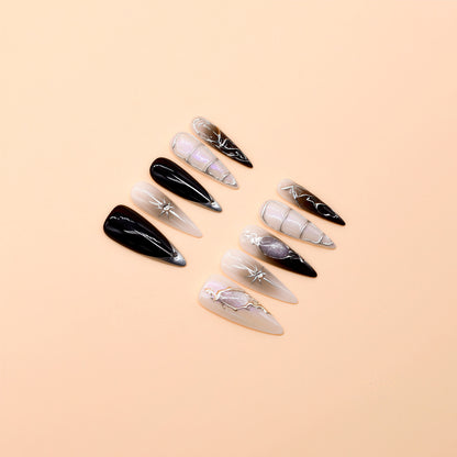 Handcrafted long almond press-on nails with black-to-grey gradient, silver chrome details, and minimalist celestial line art – Obsidian Whisper nail set.