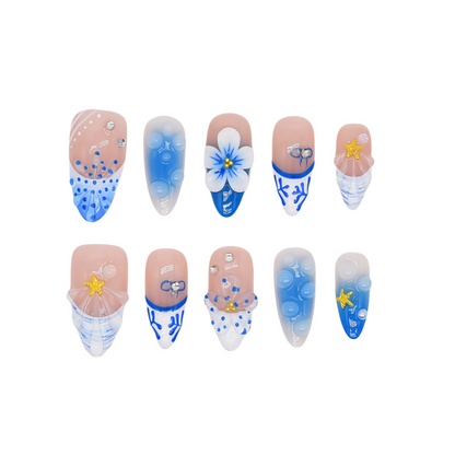 Handmade medium-length coffin press-on nails in ocean blue tones with 3D floral, coral, and starfish designs – Ocean Whimsy set.