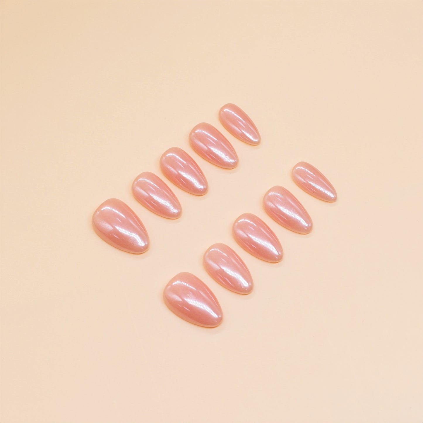 Peach Glaze nude press-on nails by You Are Angel with almond shape and high-gloss finish – soft peach-pink neutral shade.