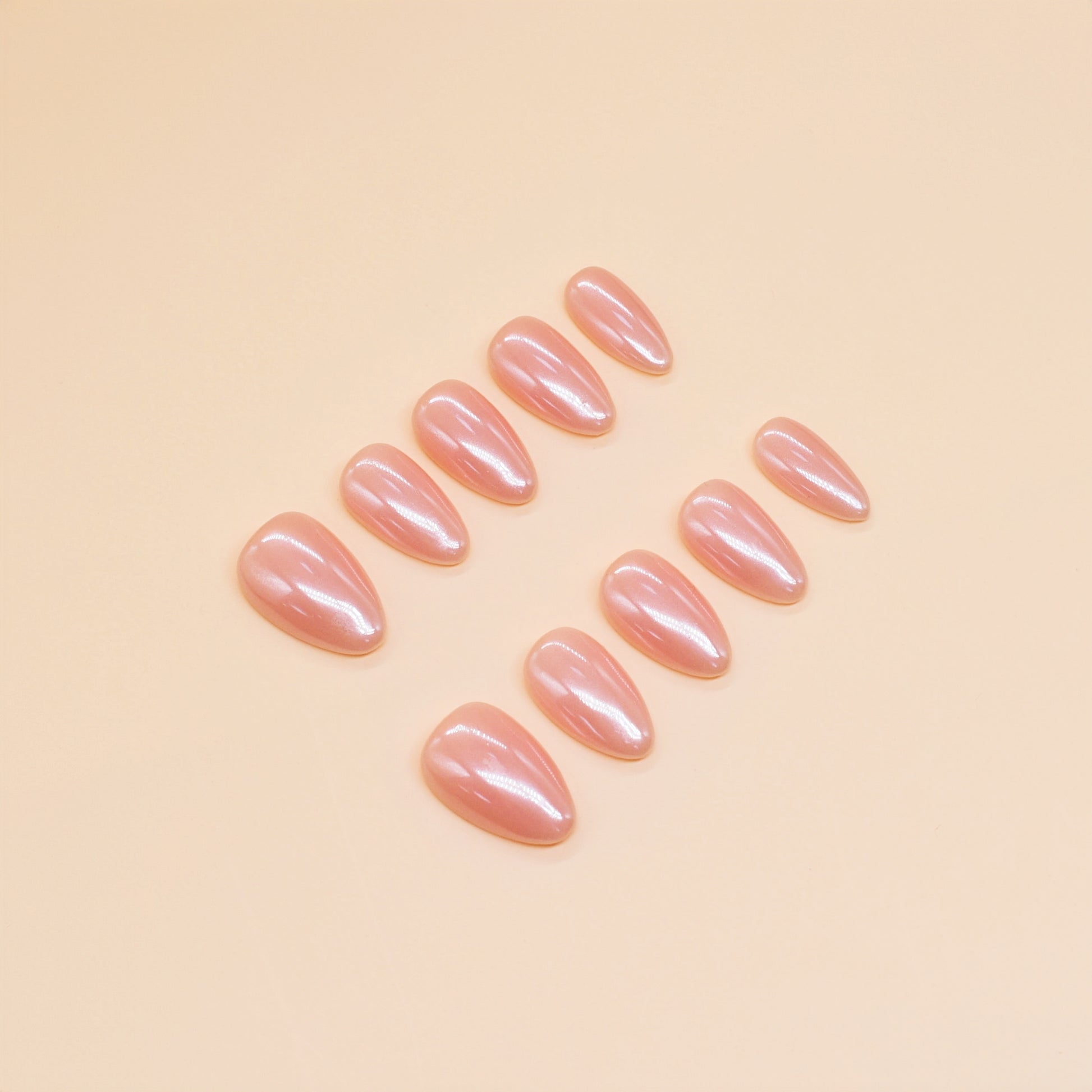 Peach Glaze nude press-on nails by You Are Angel with almond shape and high-gloss finish – soft peach-pink neutral shade.