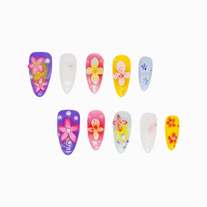 Medium almond press-on nails with bright floral 3D designs in purple, pink, yellow, and white – Petal Parade handmade nail set.