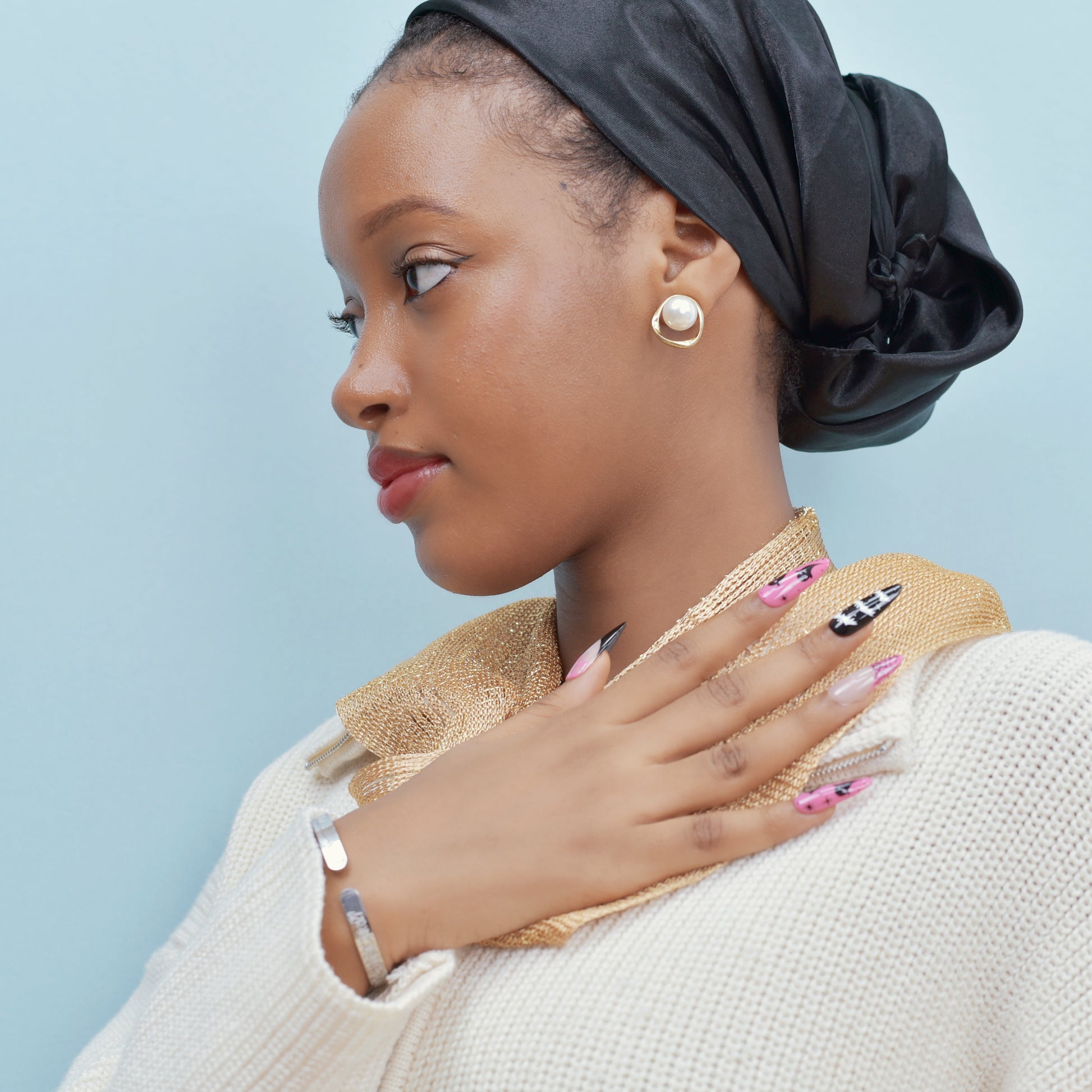 Halloween press-on nails with spider web, bats, ghosts, and dripping blood designs in black and pink.