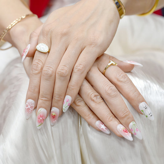 Handmade pink and white press-on nails with 3D bows, strawberry art, bunny design, and floral accents – Candy Bloom Collection