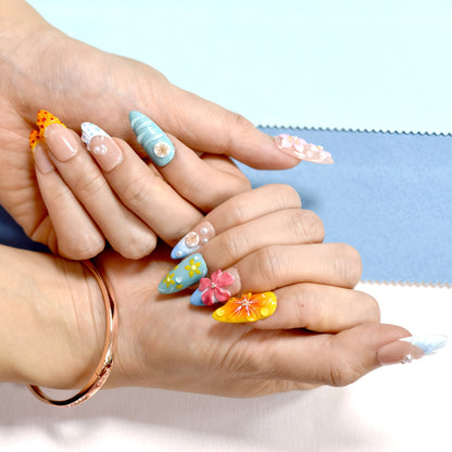 Tropical Bloom & Beach Vibes press-on nails with 3D floral and seashell accents, beach ombré colors in almond shape.