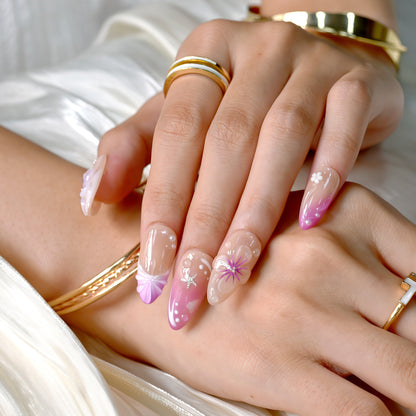 Almond-shaped coral and fuchsia press-on nails with tropical floral designs, 3D flowers, and ocean-inspired accents – Tropical Sunset Bloom set.