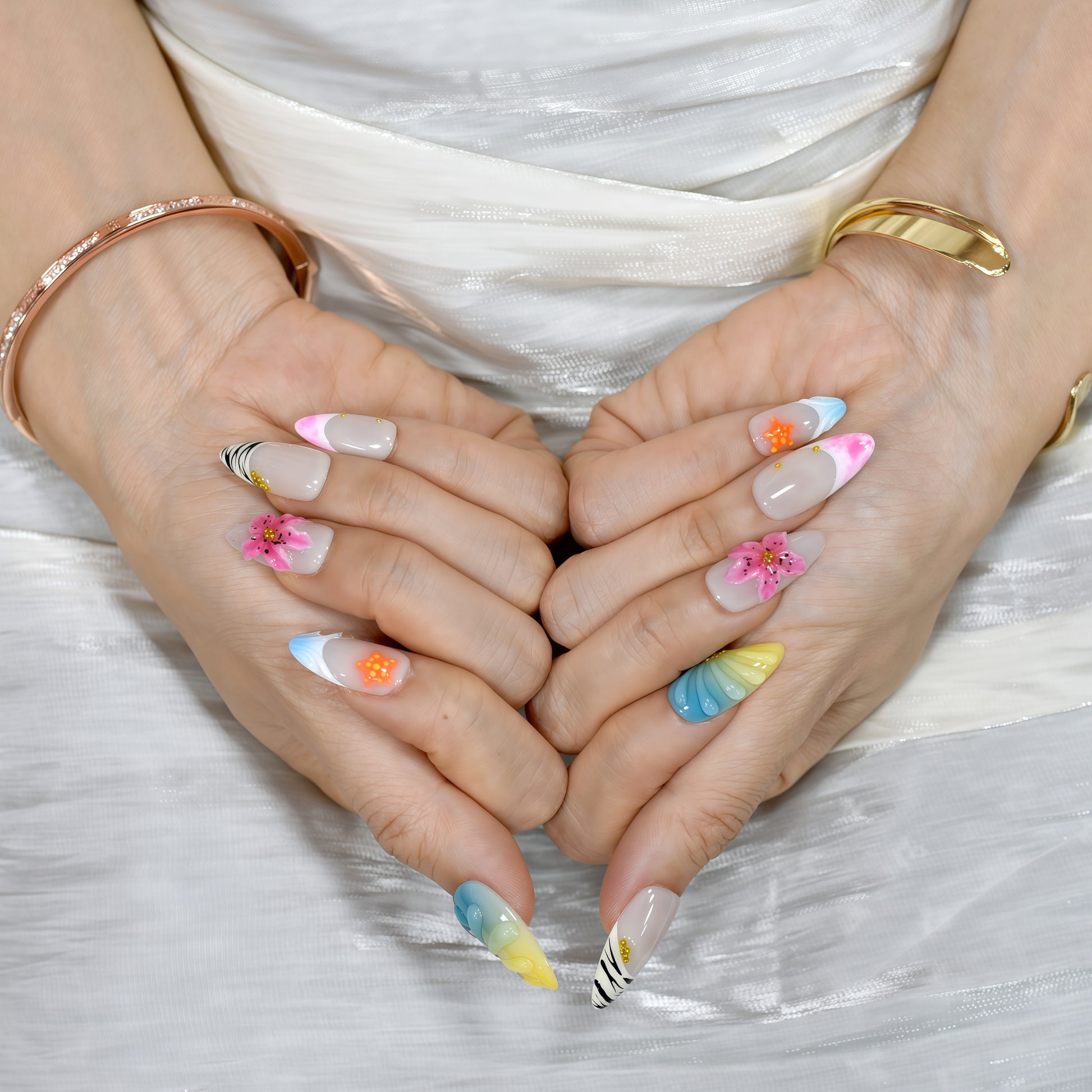 Medium almond tropical-themed press-on nails with zebra stripes, ombre seashell textures, 3D hibiscus flowers, and starfish accents.